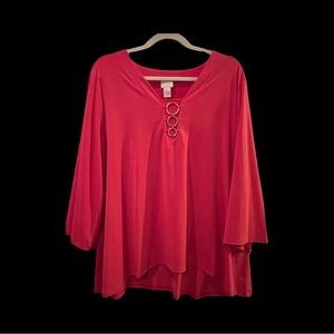 Chicos beautiful orange slight bell sleeve top with gold accent circles.